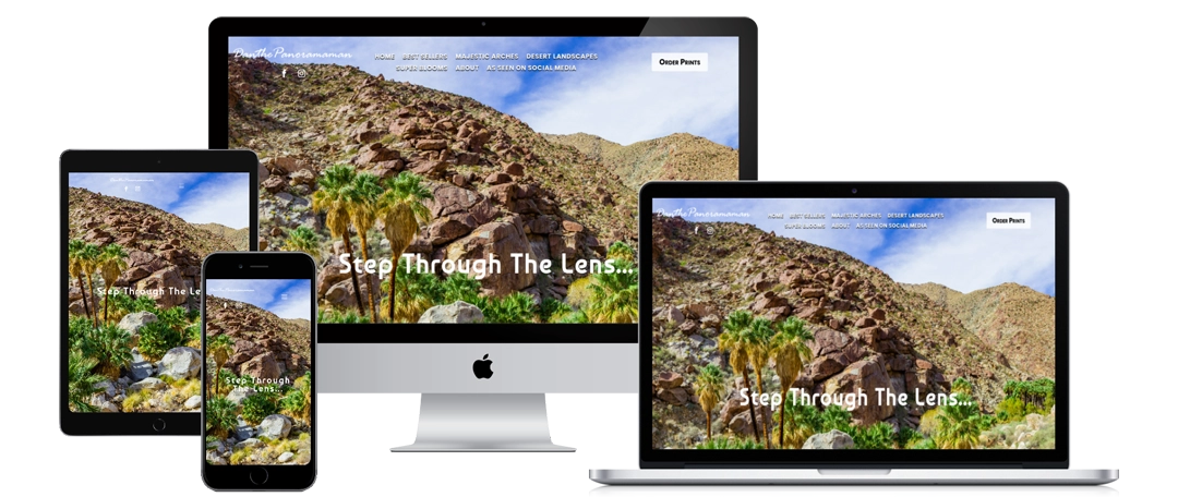 A website displaying a rocky desert landscape with palm trees and "Step Through The Lens..." text is shown on a smartphone, tablet, desktop, and laptop, demonstrating a responsive design.