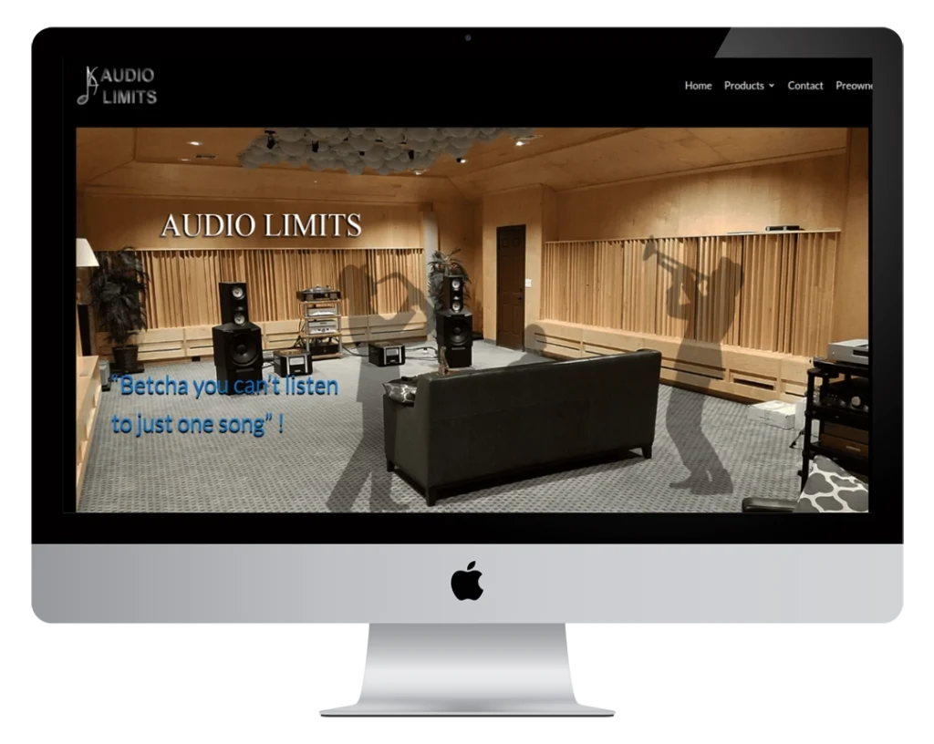 A computer screen displays the Audio Limits website, showing a modern listening room with speakers, a sofa, and acoustic panels. The text reads: “‘Betcha you can’t listen to just one song’.”.