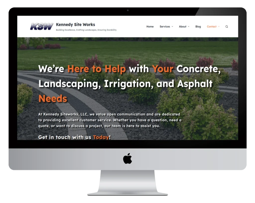 A desktop monitor displays the homepage of Kennedy Site Works, featuring bold text offering concrete, landscaping, irrigation, and asphalt services, with an emphasis on customer support and contact information.