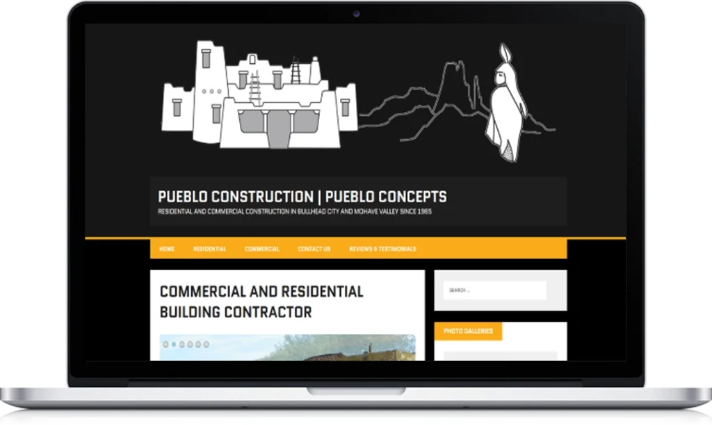 A laptop displays the homepage of Pueblo Construction | Pueblo Concepts, featuring a black header with white illustrations of a pueblo building, a mountain outline, and a bird, along with website navigation and contractor information.