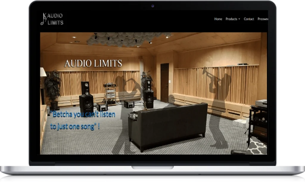 A laptop displays a website for Audio Limits, featuring a modern audio showroom with speakers, a couch, and wood paneling. Silhouettes of people are in the foreground, and navigation links are at the top right.