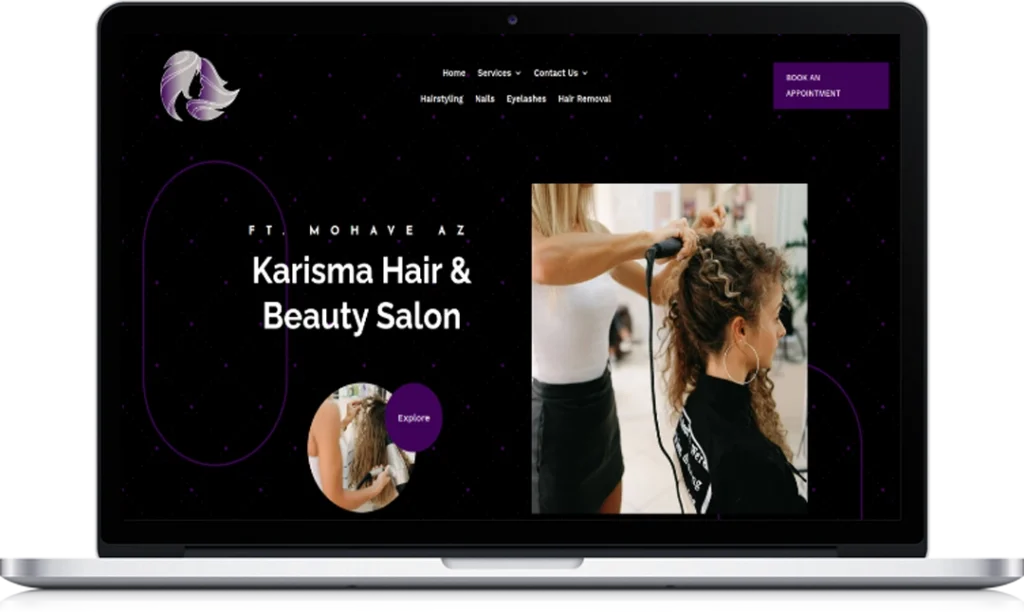A laptop screen displays the website homepage for Karisma Hair & Beauty Salon, featuring photos of a hairstylist working on a client's hair and navigation options for services, contact, and booking appointments.