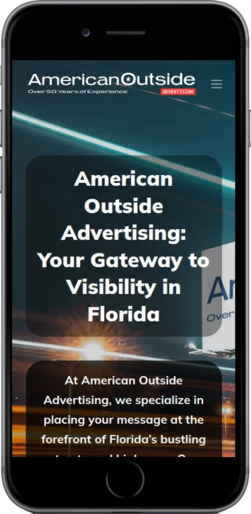 A smartphone displays the American Outside Advertising website, showing text about visibility in Florida and specializing in advertising. A blurred background image includes a sunset and part of a billboard.