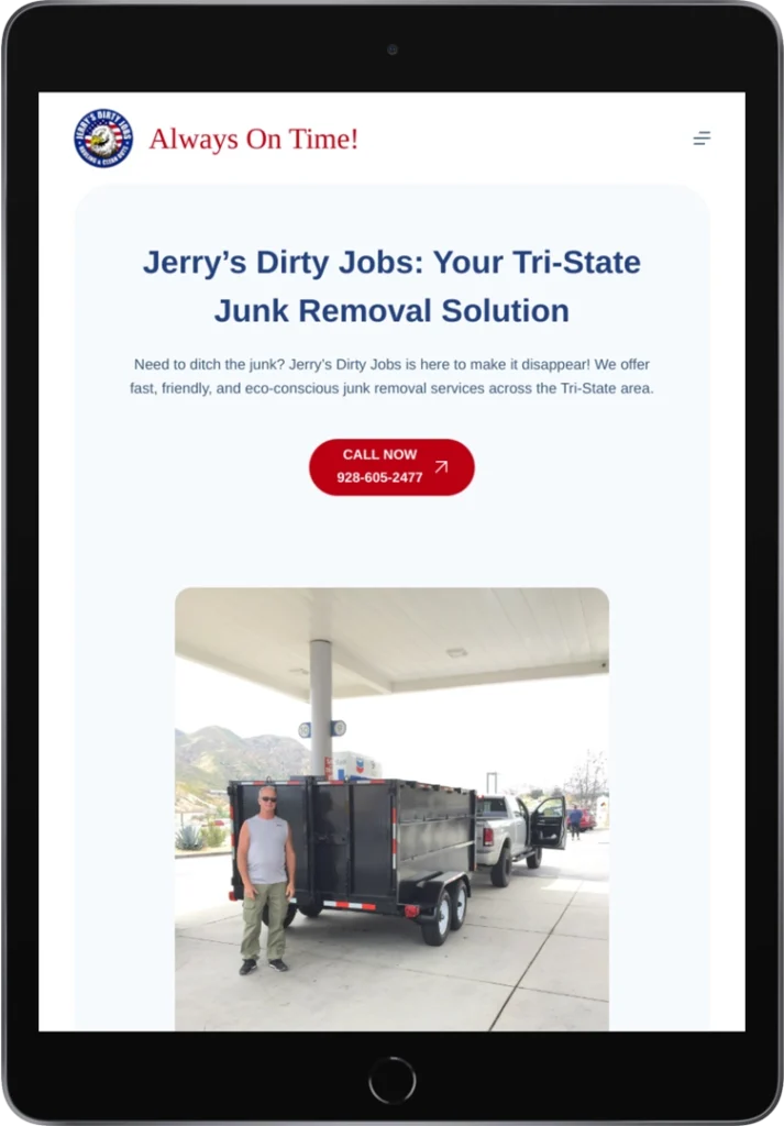 A man stands next to a large black junk removal trailer at a gas station, with mountains and a sunny sky in the background. The trailer is branded with Jerry's Dirty Jobs signage.
