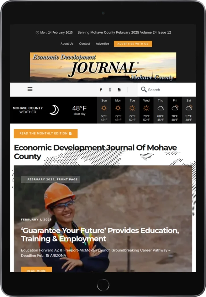 Tablet screen displaying the Economic Development Journal of Mohave County website, featuring a weather forecast, navigation menu, and a headline about education and employment opportunities with an image of a smiling worker in safety gear.