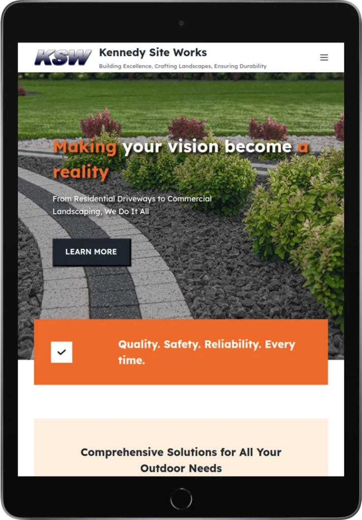 A tablet displays the Kennedy Site Works website, featuring landscaping with curved paving and trimmed bushes, the company logo, a slogan, and sections highlighting quality, safety, reliability, and comprehensive outdoor services.